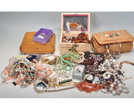 A large collection of vintage 20th century costume jewellery comprising of necklaces, watches, pewter figurines, enamel brooc