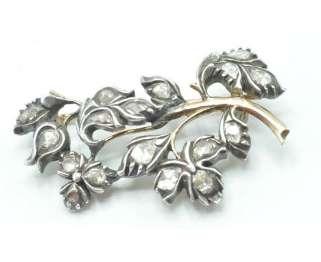 A 19th Century late Georgian / early Victorian gold and silver floral spray brooch set with seventeen faceted diamonds with h