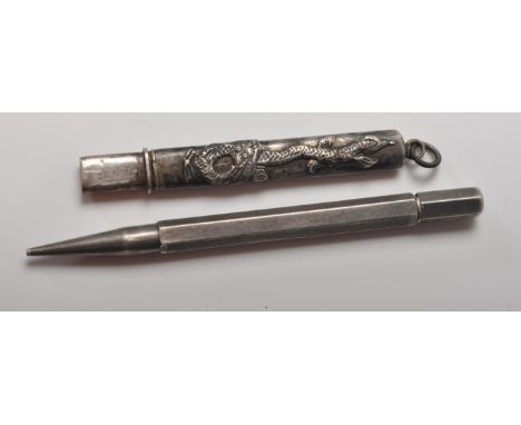 A 20th century English hallamarked silver propelling pencil by Johnson, Matthey &amp; Co, having engine turned decoration to 