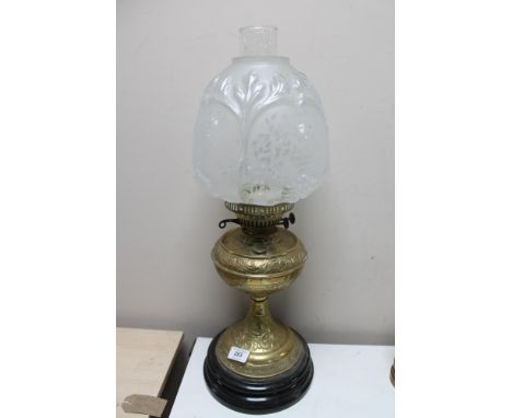 A Victorian brass and glass oil lamp 