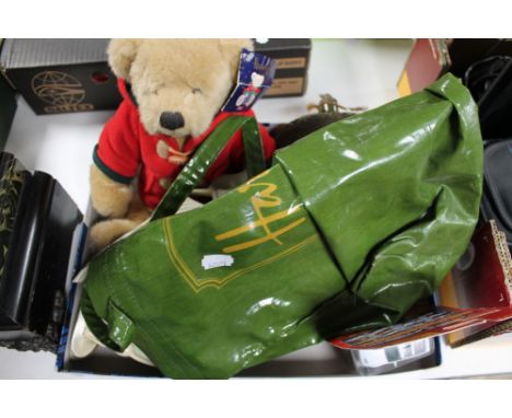 A tray of Harrods bag, teddy bear, hip flask, figures etc 