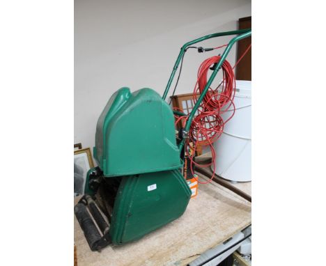 A Qualcast electric lawn mower together with Black and Decker sander, paint stripping gun 