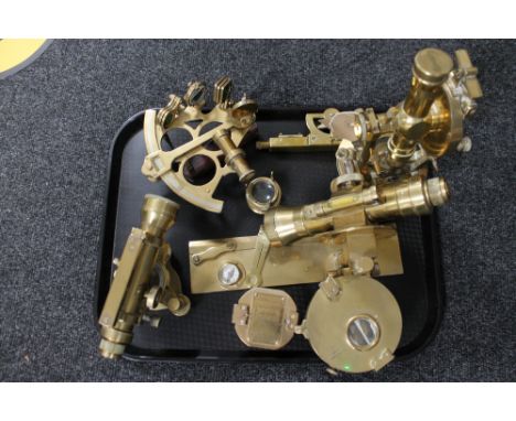 A collection of brass surveying instruments, compass, sextant, levels etc 