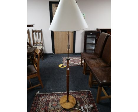 A mid 20th century teak standard lamp and shade 