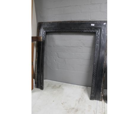 A cast Edwardian fire surround  CONDITION REPORT: 96.5cm by 96.5cm overall. The interior is 66cm wide by 82cm high. 