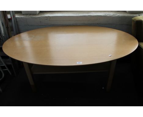 A light oak oval coffee table 