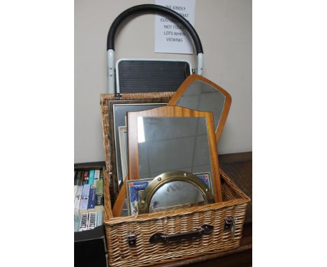 A wicker crate of teak framed mirrors, pictures and prints, metal step