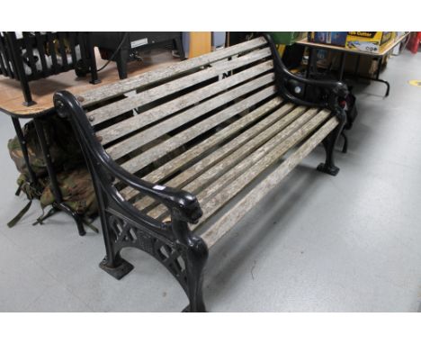 A heavy quality metal ended wooden slatted garden bench 