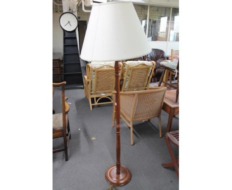 A light oak standard lamp 
