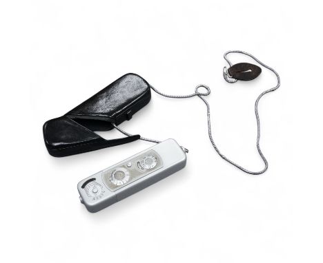 A Minolta Minox miniature camera Model B, in its original leather case with metal lanyard.