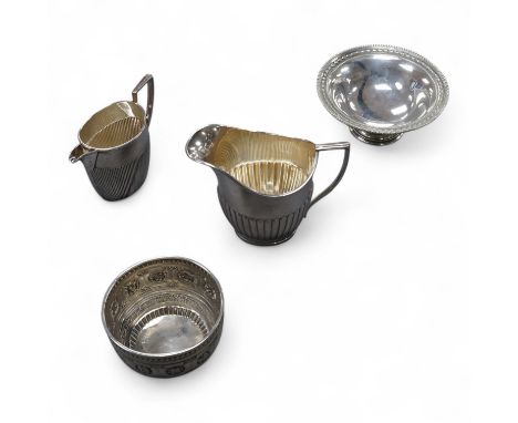 A George V demi-fluted silver cream jug, by William Hutton &amp; Sons Ltd, Sheffield, 1922, height  98mm, together with a sma