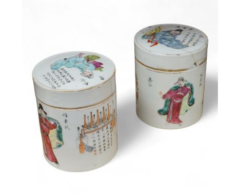 Two mid 19th century Chinese famille rose cylindrical jars and covers, enamelled with figures and calligraphy, 12cm high