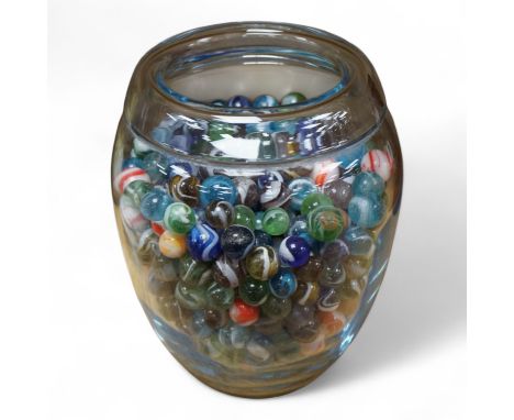 A glass vase possibly by Holmgaard, containing a large collection of late 19th/early 20th century glass marbles, 19cm high