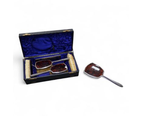 A George V five piece silver and tortoiseshell mounted dressing table set, W G Sothers Ltd, Birmingham, 1926, together with a