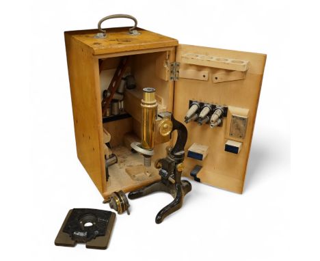 An early 20th century E. Leitz, Wetzlar, monocular microscope, in a cedar case, together with a number of alternative lenses 