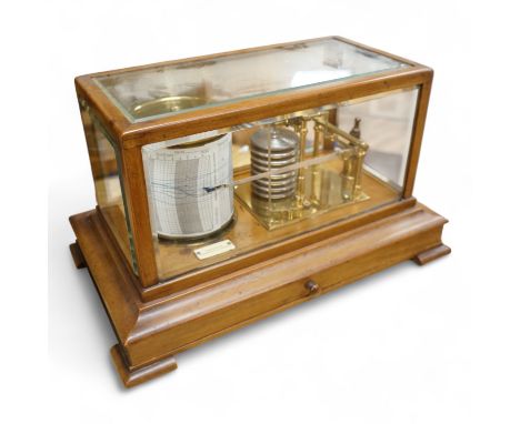 An early 20th century oak cased barograph by Finnigans Ltd., Manchester &amp; Liverpool, with integral drawer underneath cont