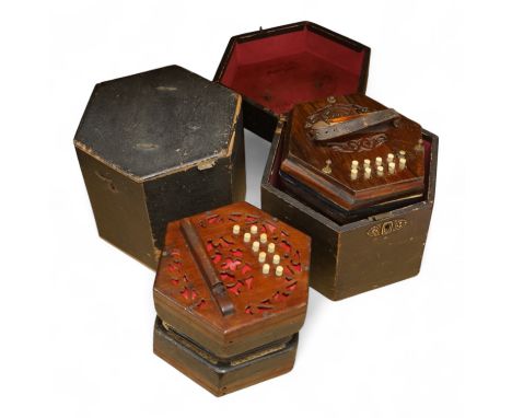 Two cased concertinas; one in mahogany with original paper label for Lachenal &amp; Co., London, the other in rosewood (a.f.)