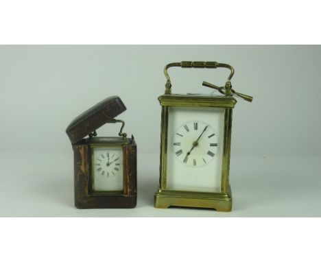 A good quality large heavy brass Carriage Clock, 13.5cms (5 1/4") high; and a miniature brass French Carriage Clock, 7.5cms (