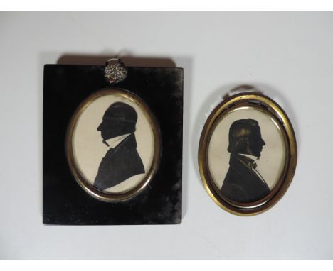 Silhouettes: a large head and shoulder "Portrait of a Gentleman, facing left, approx. 9cms (3 1/2"), in black and brass rimme