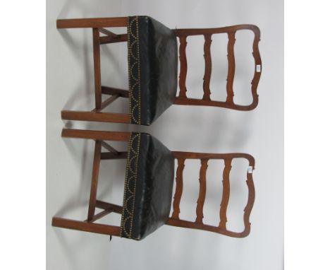 A pair of 19th Century mahogany ladder back Dining Chairs, with brass studded green leather seats on square front legs. (2)