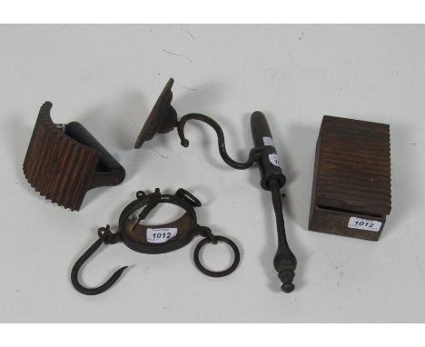An antique metal and brass goffering Iron, an antique metal crimple Iron and stand, and a brass and iron hanging Scales. (3)
