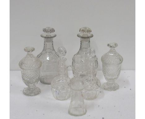 A pair of large Georgian cutglass Decanters and Stoppers; a pair of small cutglass Decanters and stoppers with ringed necks, 