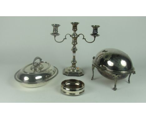 A collection of Silver Plateware, including fold-over Entree Dishes, oval Vegetable Dishes, Bowl, a tall plated three light t