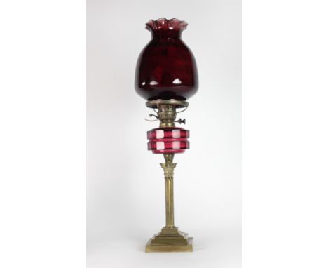 A good Corinthian style brass Table Lamp, with cutglass crimson bowl and a very large crimson glass globe shade, overall heig