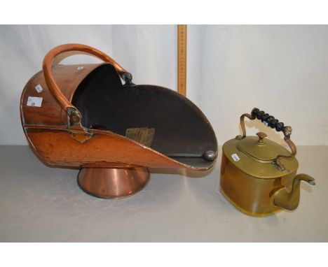 A copper coal chute together with a brass kettle and fire tools