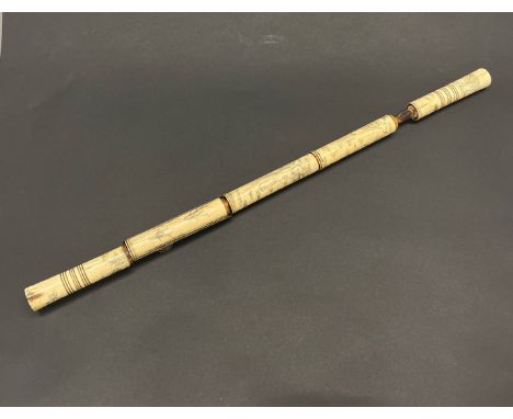 A Chinese carved bone opium pipe, L. 51cm.