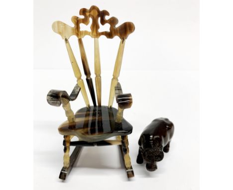 A fine carved horn rocking chair, H. 12cm, together with a carved fruitwood netsuke.