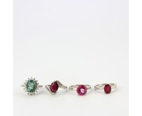 Four 925 silver stone set rings including ruby, apatite, etc.