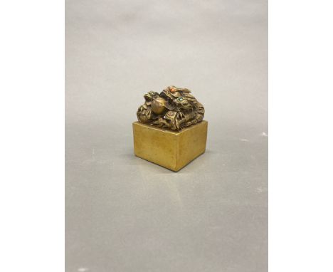 A Chinese gilt bronze/brass dragon scholars seal, 7.5 x 7.5 x 9cm.
