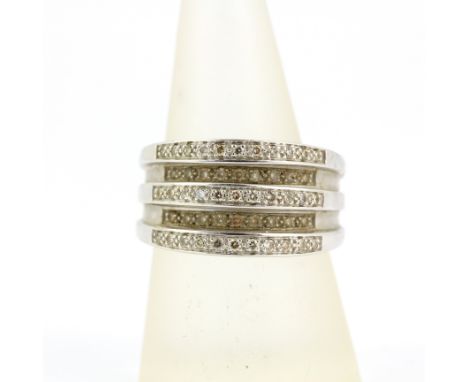 A heavy hallmarked 9ct white gold five row diamond set ring, (R.5 ).