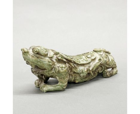 A Chinese carved jade/hardstone dragon pillow, L. 25cm H. 9cm.