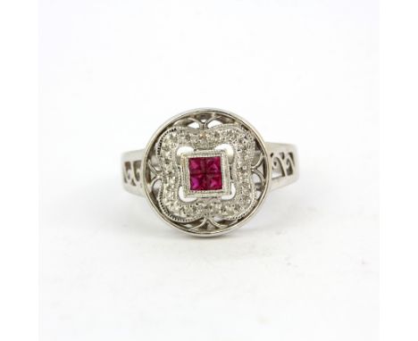 A 14ct white gold diamond and ruby set ring, (O).