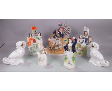 A GROUP OF SEVEN STAFFORDSHIRE FIGURESIncluding a pair of spaniels, the largest 29cm tall (7)
