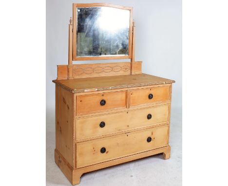 A LATE VICTORIAN PINE DRESSING CHESTArched mirror back over over two short and two long drawers on bracket feet 107cm wide; 1