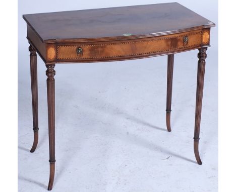 A WILLIAM IV STYLE MAHOGANY BOWFRONT SINGLE DRAWER SIDE TABLEOn reeded outswept supports 81cm wide; 73cm high46cm deep good o