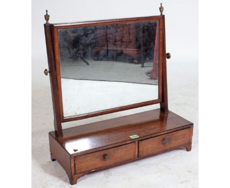 A GEORGE III MAHOGANY TOILET MIRRORTwo frieze drawers on bracket feet 56cm wide; 61cm high