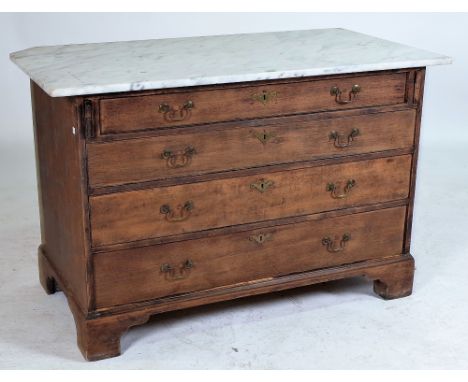 A MARBLE TOP OAK CHESTWith four long drawers 120cm wide; 78cm highThe item itself was originally a bureau with later added ma