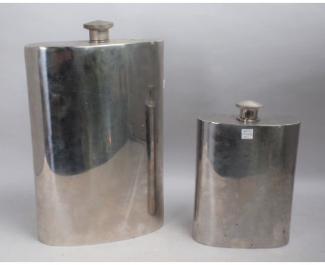 A LARGE SILVERED METAL OVERSIZED HIP FLASK 36cm TALLAnd another smaller