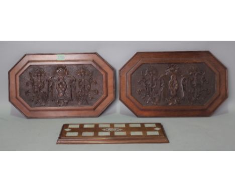 A PAIR OF CARVED OAK  PANELS AND A CRIBBAGE BOARD
