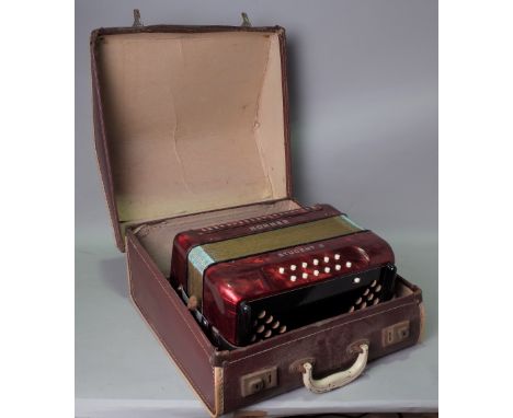 A MID 20TH CENTURY HOHNER STUDENT II ACCORDION COMPLETE WITH CASE