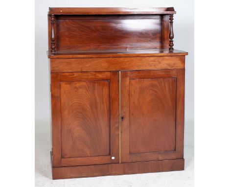 A REGENCY MAHOGANY SHELF BACK CHIFFONIERWith a pair of panel doors, 102cm wide; 123cm high