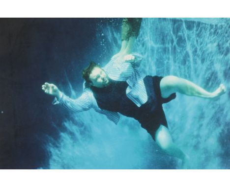 Martin Kersels (American, b. 1960). Chromogenic print photograph titled "Blue Swimmer" depicting a man in a body of water, dr