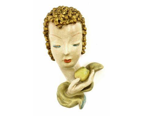 Goldscheider 'Eve' terracotta wall mask, modelled with golden hair and holding an apple, printed 'made in Austria' with facto