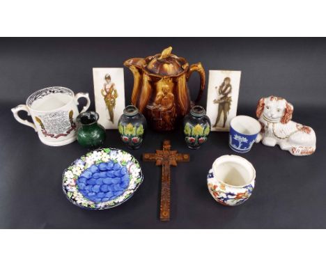 Victorian brown treacle glaze relief moulded teapot decorated with seated characters, 10" high; carved crucifix wall plaque, 