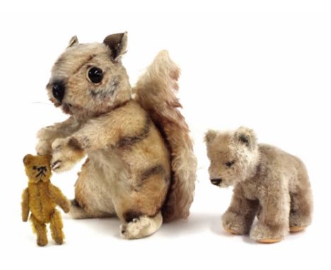 Steiff squirrel, with applied button to ear, 8" high; Steiff bear cub, button to ear, 4.5" high; together with a miniature be