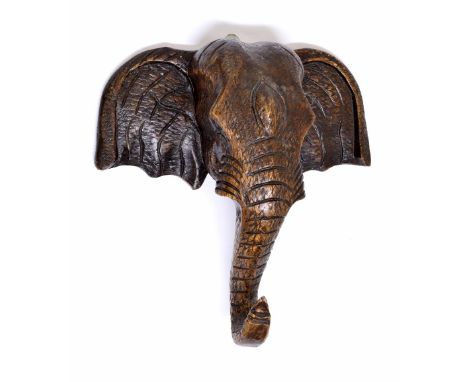 Carved oak wall plaque in the form of an elephant's head, 12" wide